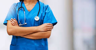 Professional nurse in blue scrubs with stethoscope