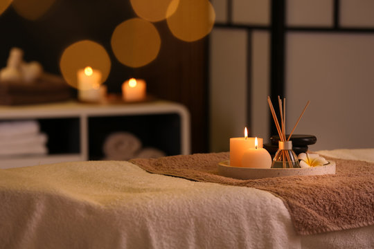 Relaxing treatment environment with candles and aromatherapy